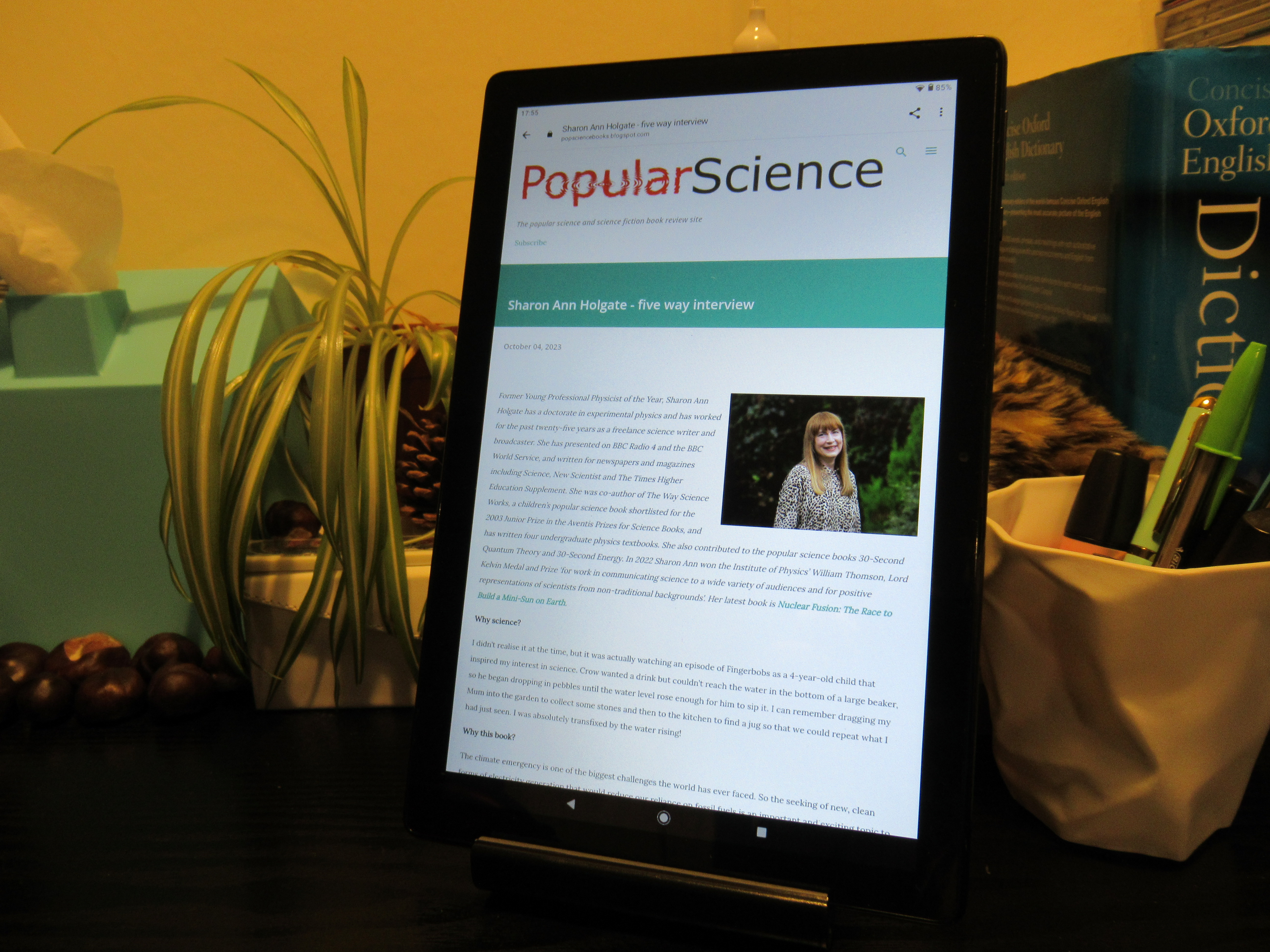 Photo of tablet displaying the first page of the interview on the Popular Science books website.